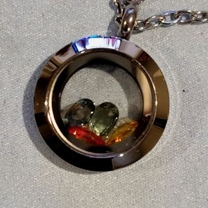 Silver Locket with loose gemstones